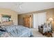 Comfortable main bedroom with a vaulted ceiling, natural light, and a peaceful sitting area at 15546 W Whitton Ave, Goodyear, AZ 85395