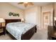 Bedroom featuring a full bed and access to ensuite bathroom through an open door at 16406 W Peppertree Ct, Surprise, AZ 85387