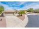 Charming single-story home with a desert-landscaped front yard, a two-car garage, and a tiled roof at 16406 W Peppertree Ct, Surprise, AZ 85387