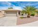 Inviting single-story home featuring a desert landscape, two-car garage, and tile roof at 16406 W Peppertree Ct, Surprise, AZ 85387