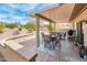 This covered patio offers comfortable seating and a tranquil outdoor space at 16406 W Peppertree Ct, Surprise, AZ 85387