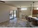 Dining area with tile flooring and access to the patio at 19746 N Wind Rose Way, Surprise, AZ 85374