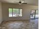 Living room featuring a large window with views of the backyard at 19746 N Wind Rose Way, Surprise, AZ 85374