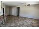 Spacious living room featuring tiled floors, neutral walls, and a ceiling fan at 19746 N Wind Rose Way, Surprise, AZ 85374