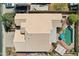 Aerial view of the property highlighting the tile roof, a private pool, and the outdoor entertaining area at 2328 N 123Rd Ln, Avondale, AZ 85392