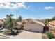 Charming single-story home featuring a three-car garage, a well-kept yard, and mature trees at 2328 N 123Rd Ln, Avondale, AZ 85392