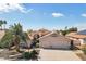 Charming single-story home with a three-car garage and well-maintained landscaping with mature palms at 2328 N 123Rd Ln, Avondale, AZ 85392