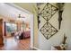 A view into a bedroom from the doorway showcasing hardwood floors and a four-poster bed at 2328 N 123Rd Ln, Avondale, AZ 85392