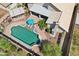 Aerial image of the backyard pool area featuring a covered patio, lounge chairs, and lush landscaping at 2328 N 123Rd Ln, Avondale, AZ 85392