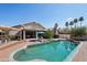 Sparkling pool with brick patio and outdoor lounge area, perfect for entertaining at 2328 N 123Rd Ln, Avondale, AZ 85392