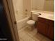 Cozy bathroom featuring a shower-tub combo, tile flooring, and a single sink vanity at 25176 W Cranston Ln, Buckeye, AZ 85326