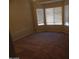 Bright bedroom with three large windows that let in plenty of natural light and neutral carpet at 25176 W Cranston Ln, Buckeye, AZ 85326