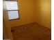 Neutral colored bedroom with carpet flooring and window at 25176 W Cranston Ln, Buckeye, AZ 85326