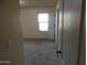 Neutral colored bedroom with carpet flooring and natural lighting at 25176 W Cranston Ln, Buckeye, AZ 85326