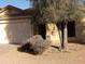 A quaint single-story house featuring a two-car garage and a neat, gravel-covered front yard at 25176 W Cranston Ln, Buckeye, AZ 85326