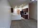 Open living room view of the kitchen with stainless appliances at 25176 W Cranston Ln, Buckeye, AZ 85326