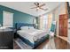 Spacious bedroom featuring a blue bed frame, hardwood floors, and modern decor at 2727 N Price Rd # 26, Chandler, AZ 85224