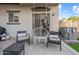 Cozy patio with swing chair, comfortable seating, and manicured landscaping at 2727 N Price Rd # 26, Chandler, AZ 85224