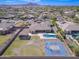 Aerial view of a home with a pool, sports court and large yard at 2830 E Fruitvale Ave, Gilbert, AZ 85297