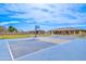 Full basketball court behind home, including basketball hoop, backboard, and painted lines at 2830 E Fruitvale Ave, Gilbert, AZ 85297