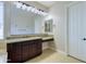 Elegant bathroom with granite countertop and a large mirror at 2830 E Fruitvale Ave, Gilbert, AZ 85297