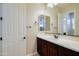 Modern bathroom featuring a dark wood vanity, an undermount sink, and updated lighting at 2830 E Fruitvale Ave, Gilbert, AZ 85297