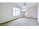 Calm bedroom with carpet floors and a bright window view at 2830 E Fruitvale Ave, Gilbert, AZ 85297