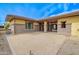 Desert landscaped front yard showcases the house and its architectural details and pavers at 2830 E Fruitvale Ave, Gilbert, AZ 85297