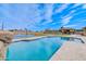 Resort-style backyard boasts a pool, sport court, and covered outdoor area at 2830 E Fruitvale Ave, Gilbert, AZ 85297