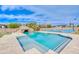 Backyard oasis with a pool, rock features, and a sport court at 2830 E Fruitvale Ave, Gilbert, AZ 85297