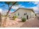 Backyard features a rockscape design with various plants and a brick wall at 3301 S Goldfield Rd # 2105, Apache Junction, AZ 85119