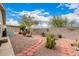 Beautiful backyard featuring desert landscaping, a brick-lined walkway and block wall providing a private outdoor space at 3301 S Goldfield Rd # 2105, Apache Junction, AZ 85119