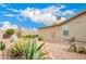 The backyard features desert landscaping, and a brick-lined walkway and includes a cozy sunroom at 3301 S Goldfield Rd # 2105, Apache Junction, AZ 85119