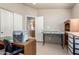 Bright bedroom featuring an ironing table, shelves and closet at 3301 S Goldfield Rd # 2105, Apache Junction, AZ 85119