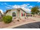 Inviting single-story home with a well-maintained front yard, covered carport, and red shutters at 3301 S Goldfield Rd # 2105, Apache Junction, AZ 85119