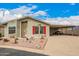 Charming single-story home with a covered carport, low-maintenance landscaping and red shutters at 3301 S Goldfield Rd # 2105, Apache Junction, AZ 85119