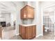 Hallway area featuring upper and lower cabinets, tile floors, and access to the bathroom at 3301 S Goldfield Rd # 2105, Apache Junction, AZ 85119