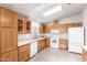 Bright kitchen with wood cabinets, modern appliances, and a window providing natural light at 3301 S Goldfield Rd # 2105, Apache Junction, AZ 85119