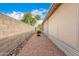 Rockscape side yard with gravel and low-water plants at 3301 S Goldfield Rd # 2105, Apache Junction, AZ 85119