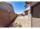Expansive backyard featuring a gravel area with potential for customized landscaping and outdoor activities at 34990 N Spur Cir, San Tan Valley, AZ 85144