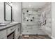 This bathroom features a walk in shower, glass door, gray tile, and modern finishes at 34990 N Spur Cir, San Tan Valley, AZ 85144