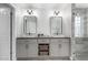 This bathroom features double vanity, storage baskets, wood look floors, and glass shower at 34990 N Spur Cir, San Tan Valley, AZ 85144