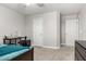 Comfortable bedroom featuring neutral tones, desk area, and closet, perfect for relaxation and study at 34990 N Spur Cir, San Tan Valley, AZ 85144