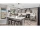 Bright kitchen features a stylish backsplash, stainless steel appliances, and a quartz countertop island at 34990 N Spur Cir, San Tan Valley, AZ 85144