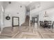 Spacious living room featuring stylish flooring, a staircase, and ample natural light at 34990 N Spur Cir, San Tan Valley, AZ 85144