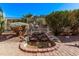 Charming water feature with rock accents amidst landscaped backyard setting at 4203 E Narrowleaf Dr, Gilbert, AZ 85298