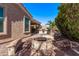 Relaxing outdoor patio with a stone fire pit and landscaped surroundings, perfect for entertaining at 4203 E Narrowleaf Dr, Gilbert, AZ 85298