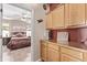 View into bedroom, showcasing warm cabinet space and access to the main bedroom with ensuite bathroom at 4203 E Narrowleaf Dr, Gilbert, AZ 85298