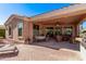 Spacious covered patio with outdoor seating, dining, and grilling area for backyard enjoyment at 4203 E Narrowleaf Dr, Gilbert, AZ 85298