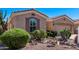 Inviting home exterior with well-manicured landscaping, desert plants, and charming curb appeal at 4203 E Narrowleaf Dr, Gilbert, AZ 85298